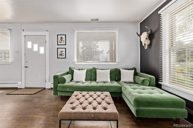 3464 S Downing St, Englewood, CO 80113 - living room featuring a baseboard radiator, baseboard heating, and wood finished floors