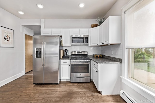 3464 S Downing St, Englewood, CO 80113 - kitchen featuring stainless steel appliances, baseboard heating, white cabinetry, tasteful backsplash, and recessed lighting