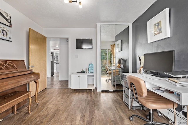 3464 S Downing St, Englewood, CO 80113 - home office featuring wood finished floors and a textured ceiling