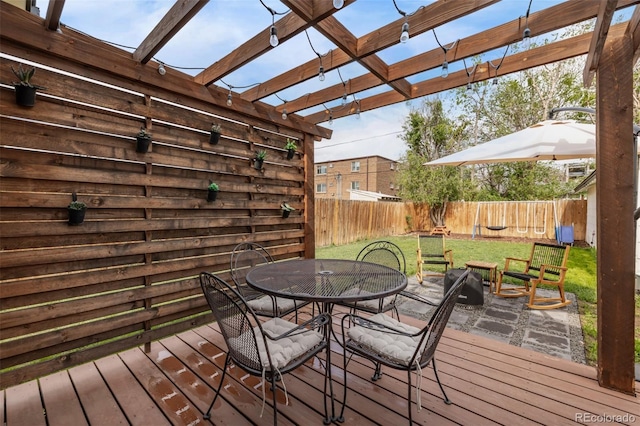 3464 S Downing St, Englewood, CO 80113 - wooden terrace with outdoor dining area, a fenced backyard, and a pergola