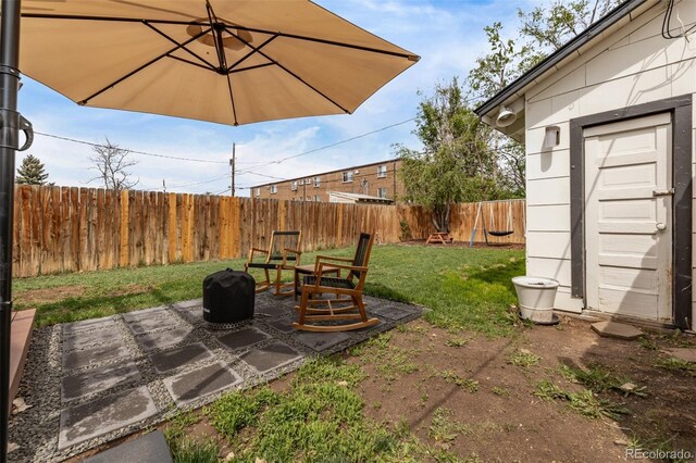 3464 S Downing St, Englewood, CO 80113 - fenced backyard featuring an outdoor fire pit