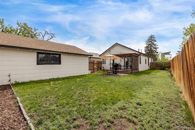 3464 S Downing St, Englewood, CO 80113 - fenced backyard featuring a patio area