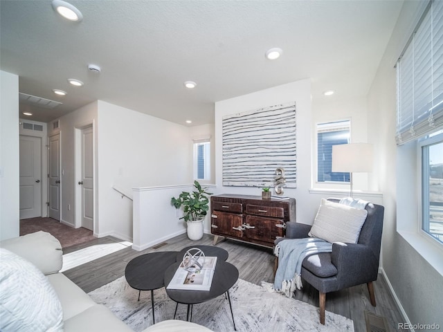 living area with hardwood / wood-style flooring