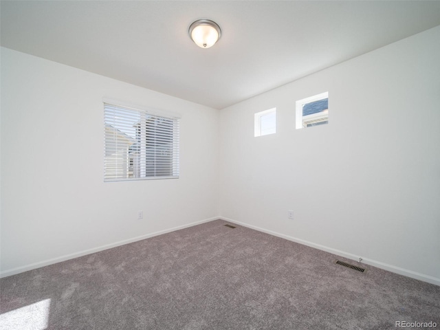 spare room featuring carpet flooring