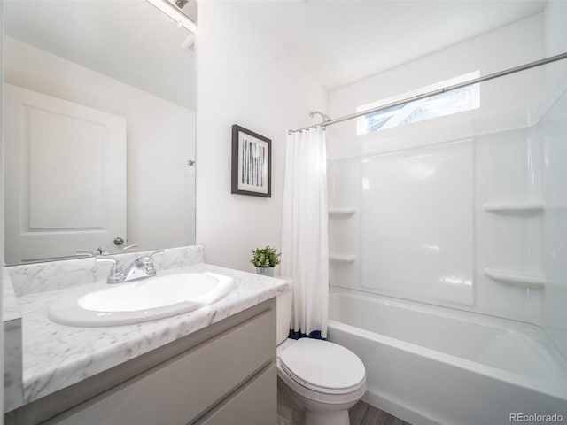 full bathroom featuring toilet, vanity, and shower / tub combo with curtain