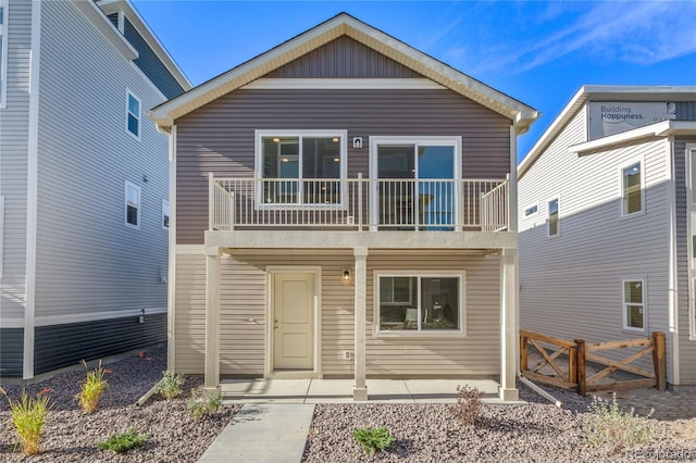 view of front of home with a balcony