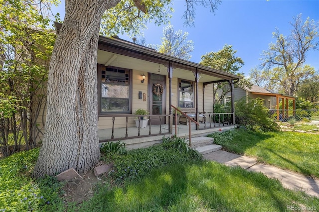 306 E Cannon St, Lafayette, CO 80026 - view of front of property with covered porch and a front yard