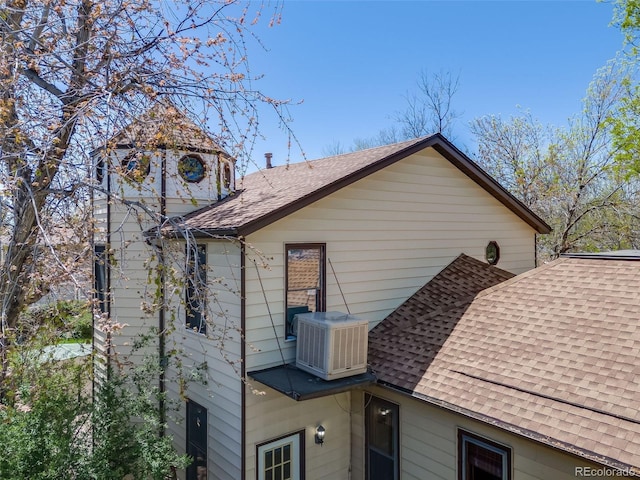 306 E Cannon St, Lafayette, CO 80026 - view of side of property with central air condition unit and roof with shingles