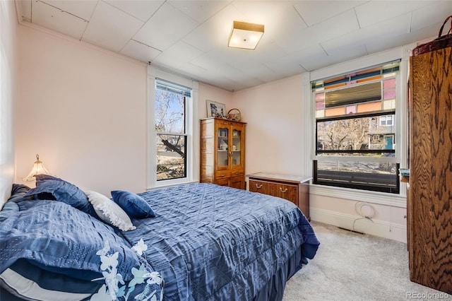 306 E Cannon St, Lafayette, CO 80026 - bedroom featuring crown molding, baseboards, light colored carpet, and visible vents