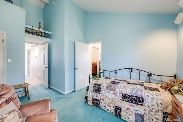 306 E Cannon St, Lafayette, CO 80026 - bedroom featuring carpet floors, baseboards, and a towering ceiling