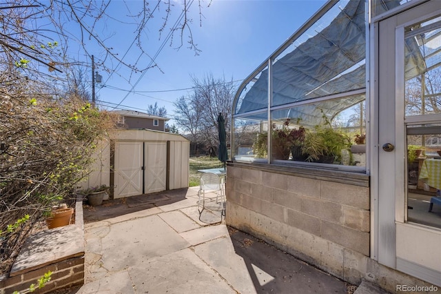 306 E Cannon St, Lafayette, CO 80026 - view of patio featuring a storage unit and an outdoor structure