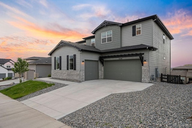 5390 Edenborn Way, Castle Rock, CO 80104 - craftsman inspired home featuring an attached garage, concrete driveway, and stone siding