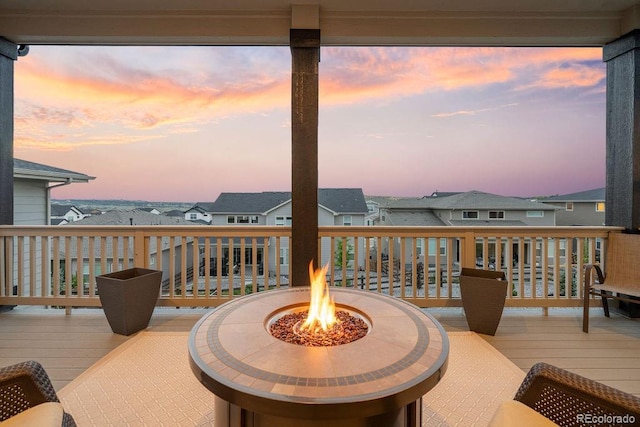 5390 Edenborn Way, Castle Rock, CO 80104 - deck at dusk featuring an outdoor fire pit and a residential view
