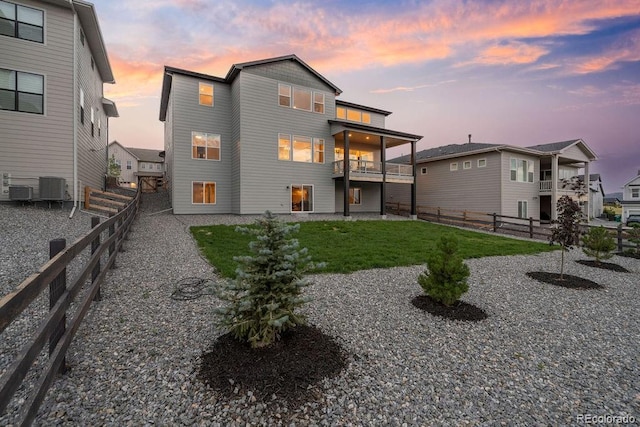 5390 Edenborn Way, Castle Rock, CO 80104 - back of house at dusk with a fenced backyard and a balcony