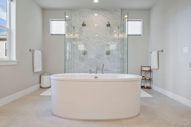 5390 Edenborn Way, Castle Rock, CO 80104 - bathroom featuring a soaking tub, plenty of natural light, and a marble finish shower