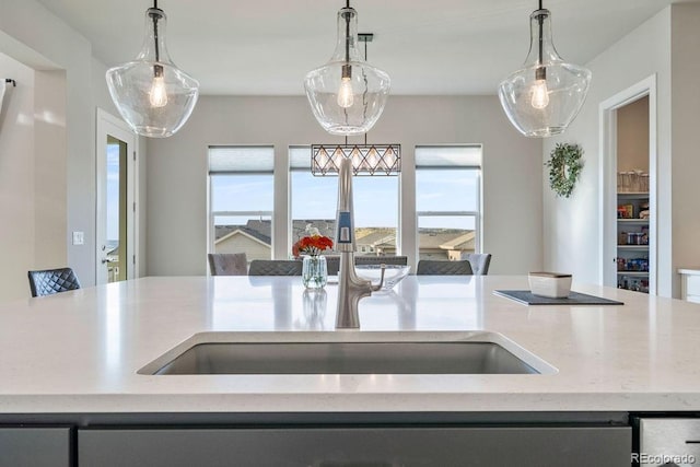 5390 Edenborn Way, Castle Rock, CO 80104 - kitchen with decorative light fixtures and light stone counters