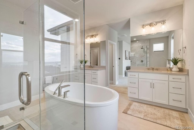 5390 Edenborn Way, Castle Rock, CO 80104 - bathroom featuring a shower stall, two vanities, and a freestanding tub