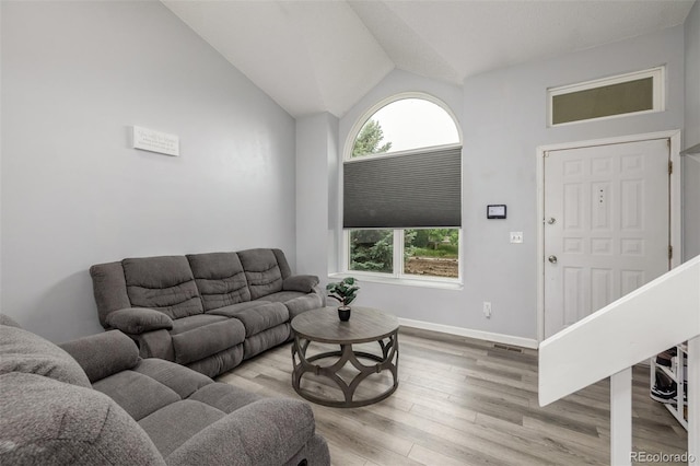 4512 Bramble Ln, Colorado Springs, CO 80925 - living area with vaulted ceiling and light wood-type flooring