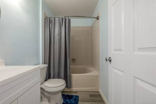 4512 Bramble Ln, Colorado Springs, CO 80925 - bathroom featuring shower / tub combo with curtain, vanity, and wood finished floors