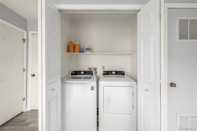4512 Bramble Ln, Colorado Springs, CO 80925 - washroom featuring washer and dryer and light wood finished floors