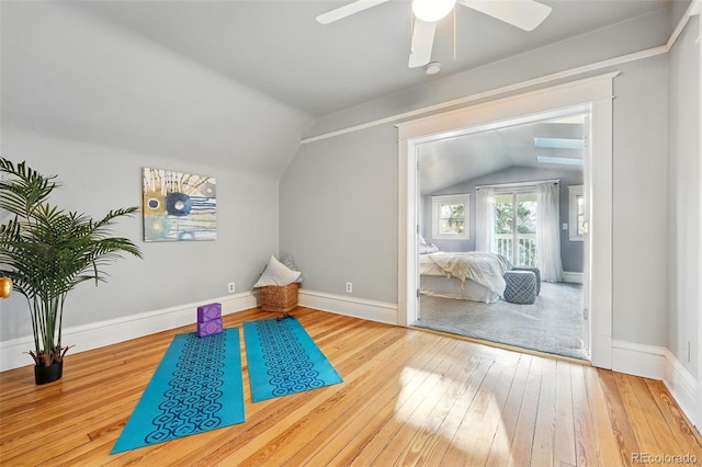 sitting room featuring baseboards, a ceiling fan, lofted ceiling, and hardwood / wood-style flooring