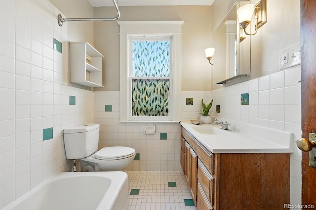 full bathroom featuring vanity, a tub to relax in, tile patterned flooring, tile walls, and toilet