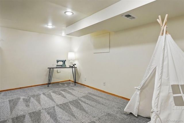 empty room featuring carpet flooring, baseboards, and visible vents