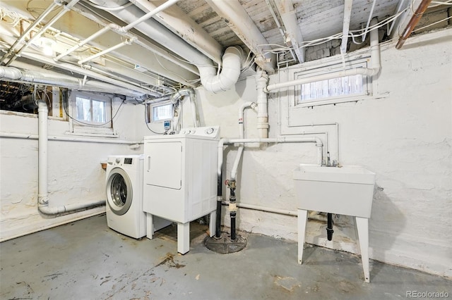 below grade area featuring washing machine and dryer