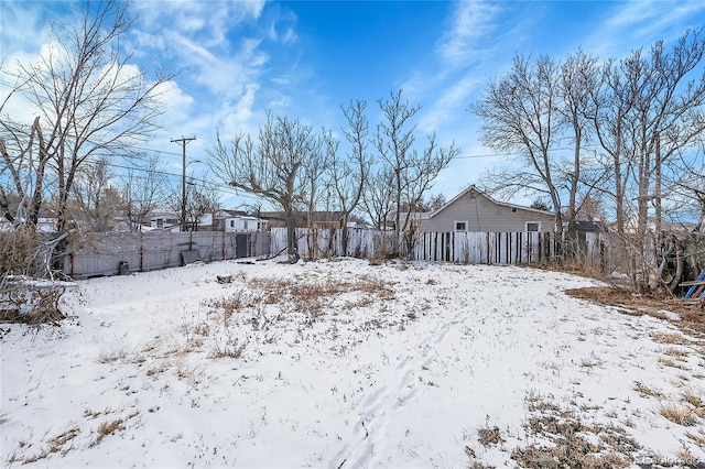 view of yard layered in snow