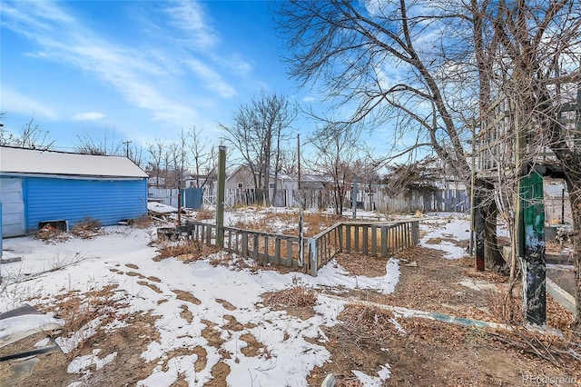 view of yard layered in snow