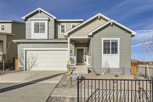 view of front facade featuring concrete driveway, an attached garage, and fence