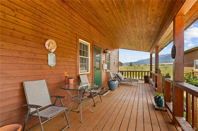 wooden terrace with a mountain view