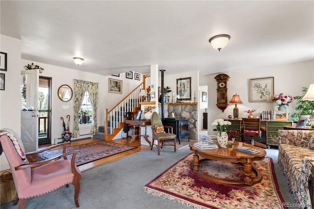 28 County Road 136, Westcliffe, CO 81252 - carpeted living room with stairway and a wood stove