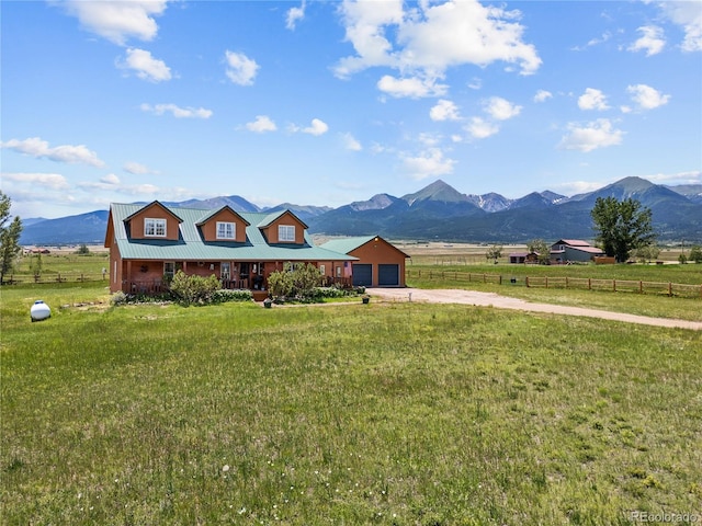 28 County Road 136, Westcliffe, CO 81252 - view of front of property with a mountain view, a porch, a front lawn, and fence