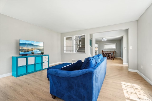 6565 W 99th Ave, Broomfield, CO 80021 - living area featuring baseboards, wood finished floors, and visible vents