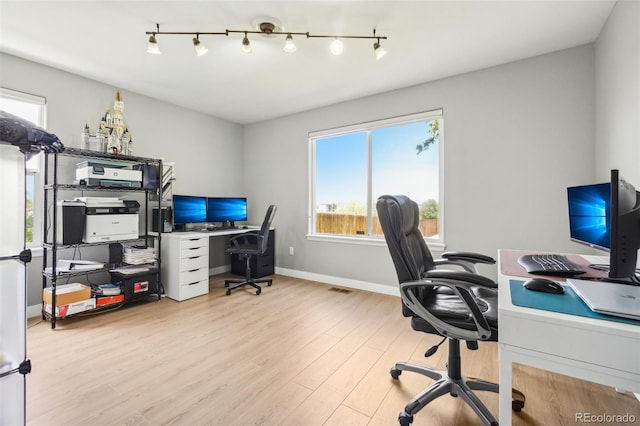 6565 W 99th Ave, Broomfield, CO 80021 - home office featuring baseboards, visible vents, track lighting, and wood finished floors
