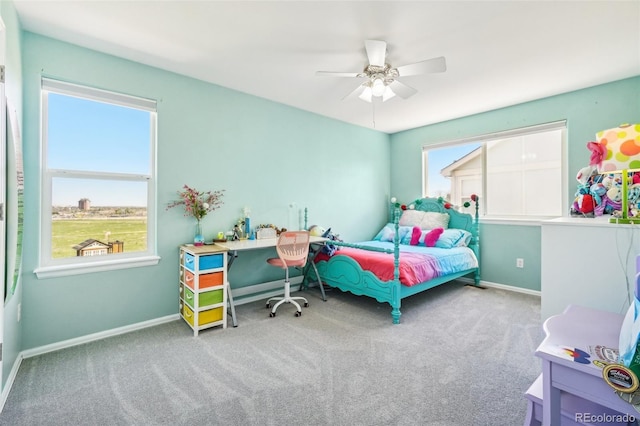6565 W 99th Ave, Broomfield, CO 80021 - carpeted bedroom featuring baseboards, multiple windows, and ceiling fan