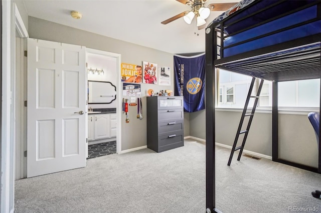 6565 W 99th Ave, Broomfield, CO 80021 - bedroom with carpet floors, baseboards, ceiling fan, and connected bathroom