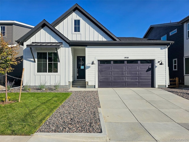 view of front of home featuring a garage and a front yard