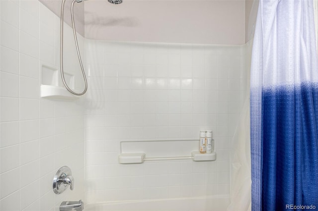 bathroom with shower / bath combination with curtain