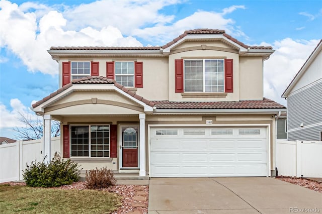 mediterranean / spanish-style home with a garage