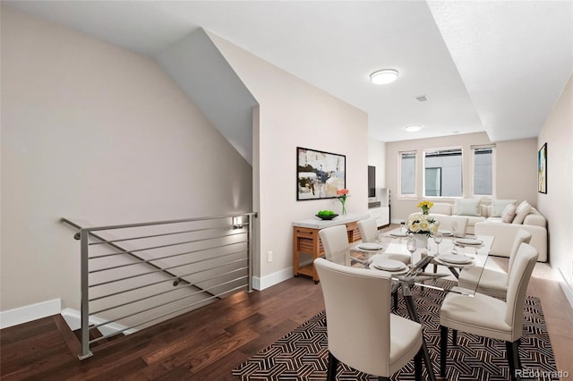 dining room with dark hardwood / wood-style floors