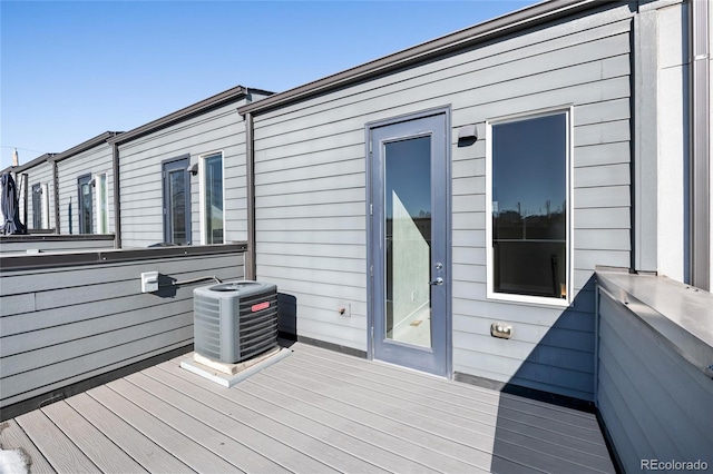 wooden terrace featuring central air condition unit