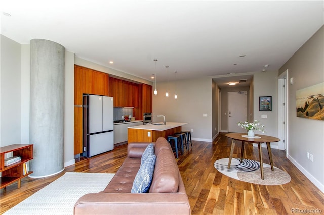 4200 W 17th Ave Unit 411, Denver, CO 80204 - living room with dark wood finished floors and recessed lighting