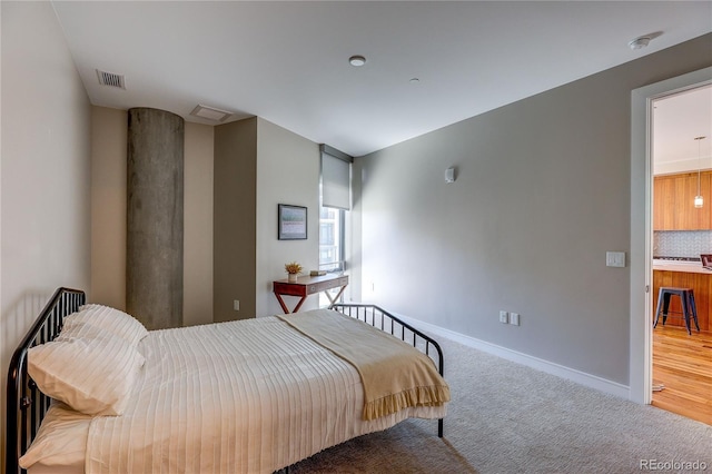 4200 W 17th Ave Unit 411, Denver, CO 80204 - bedroom featuring carpet floors and baseboards