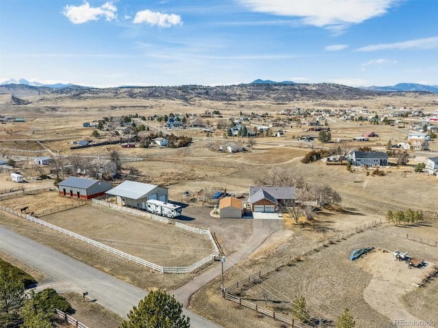 aerial view with a mountain view and a rural view