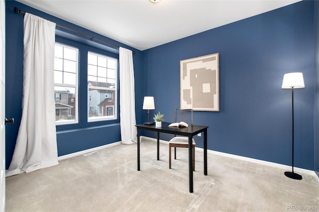 office area featuring light colored carpet