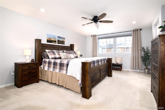 bedroom with light carpet and ceiling fan