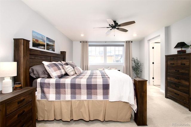 bedroom featuring ceiling fan and light colored carpet