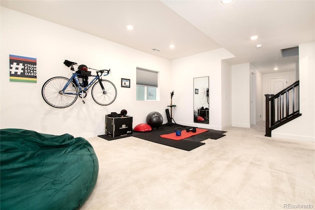 exercise room with light carpet